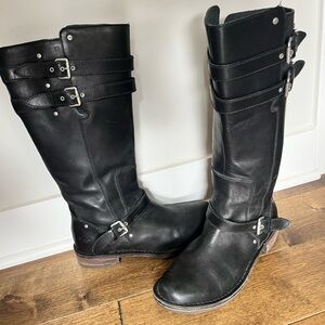 Tall genuine leather UGG boots with fleece footbed.